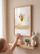Toddler reaching toward a framed BETVA firefly watercolor print in a calm oak-and-beige nursery